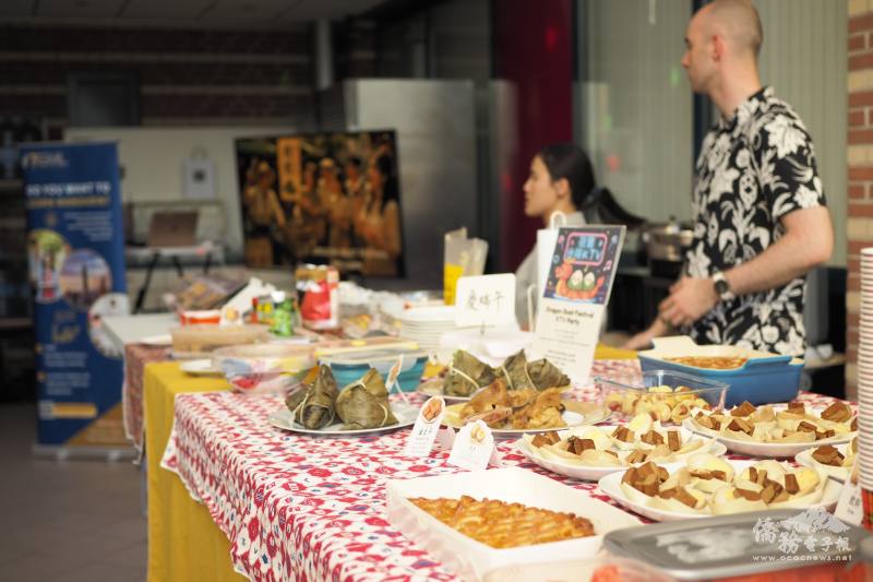 The table was filled with rice dumplings and a variety of dishes prepared for the celebration.