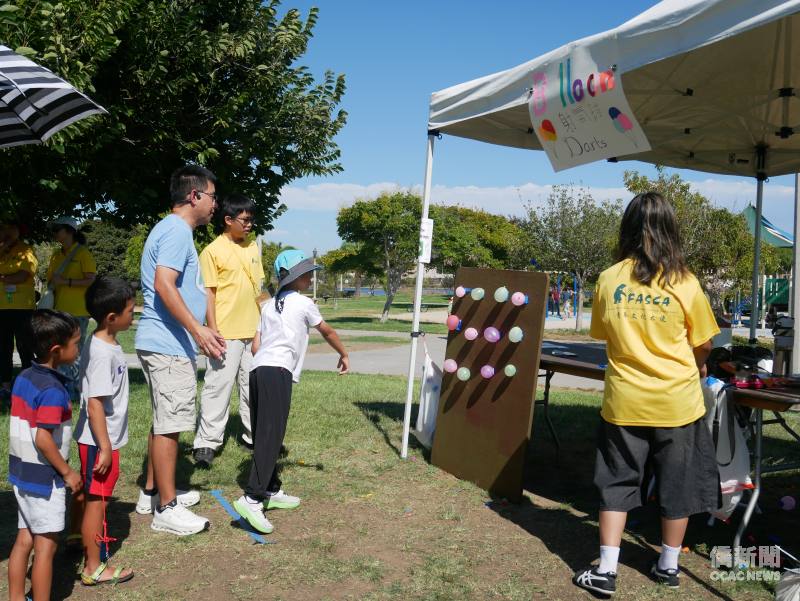 Balloon darts booth attracts wide range of guests