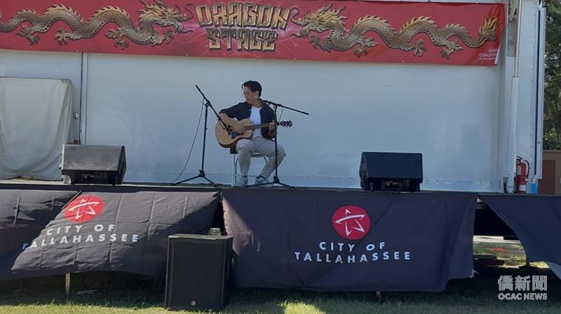 Florida State University doctoral student Shaka Li performs a selection of Taiwanese songs on the Dragon Stage. (Photo provided by Carl Huang)
